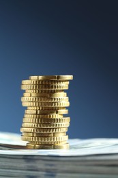 Photo of Stack of euro coins on blue background