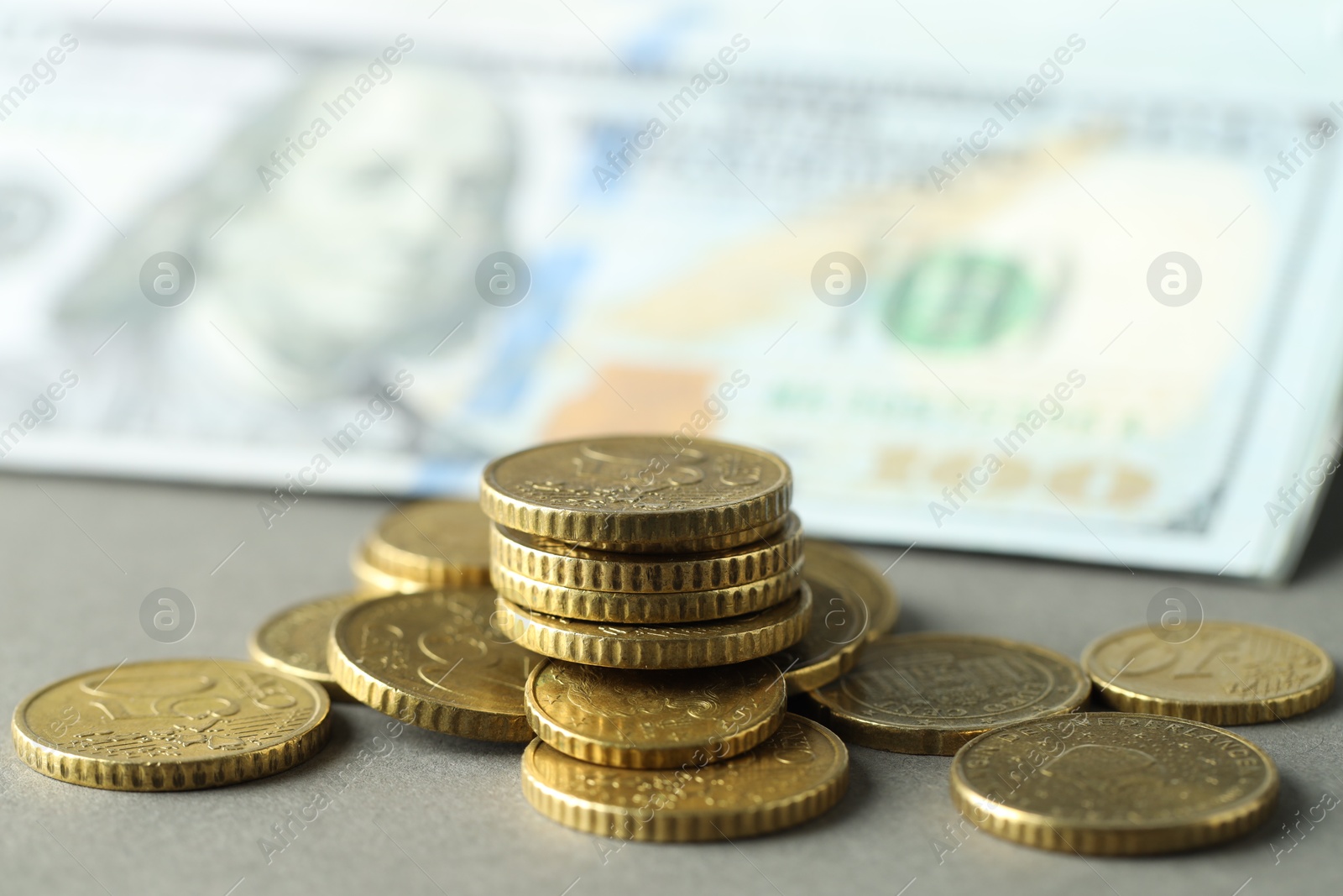 Photo of Many euro coins on grey background, closeup