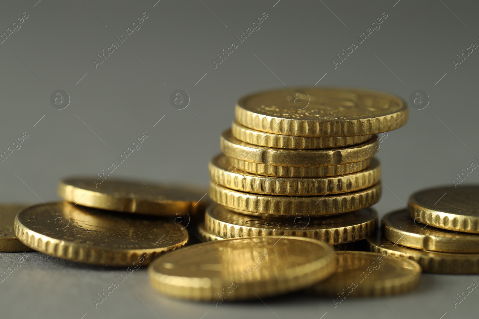 Photo of Many euro coins on grey background, closeup