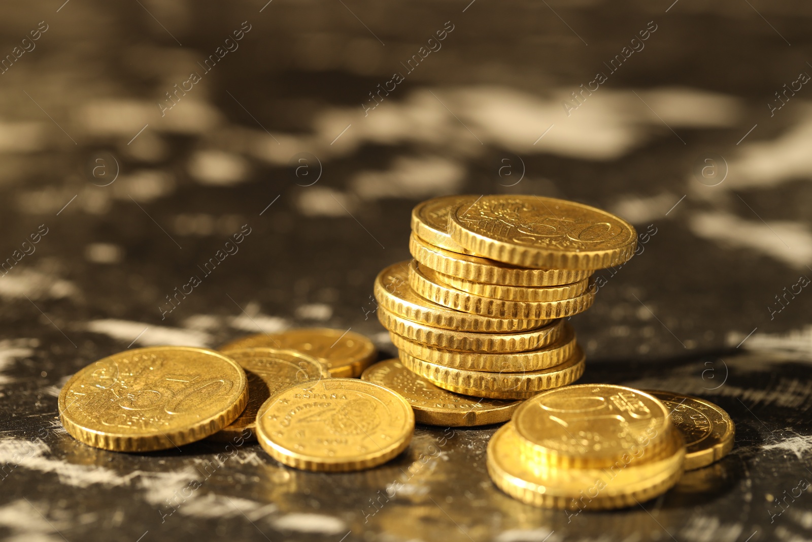 Photo of Many euro coins on dark table, closeup