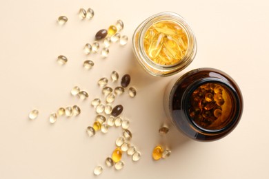 Pharmacist. Different pills in plastic bottles on beige background, flat lay