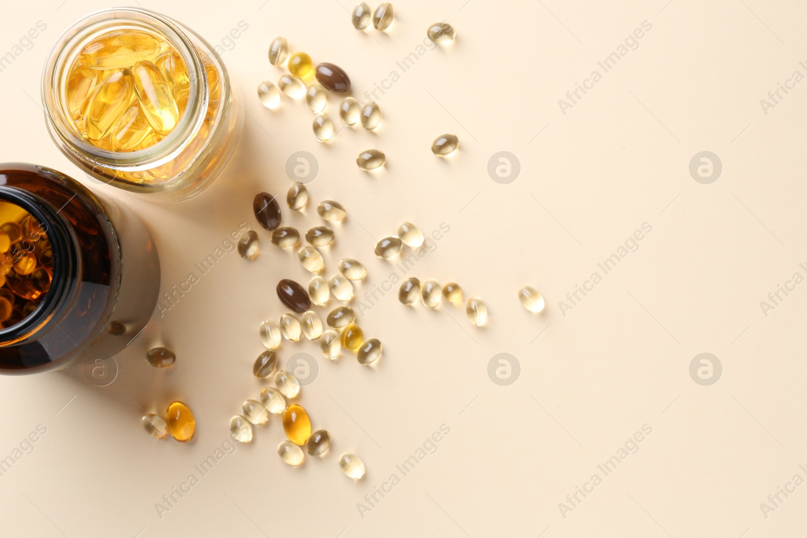 Photo of Pharmacist. Different pills in plastic bottles on beige background, flat lay. Space for text