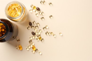 Photo of Pharmacist. Different pills in plastic bottles on beige background, flat lay. Space for text