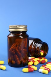 Photo of Pharmacist. Pills in plastic bottles on blue background