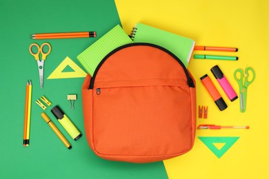 Photo of Backpack and different school supplies on color background, flat lay