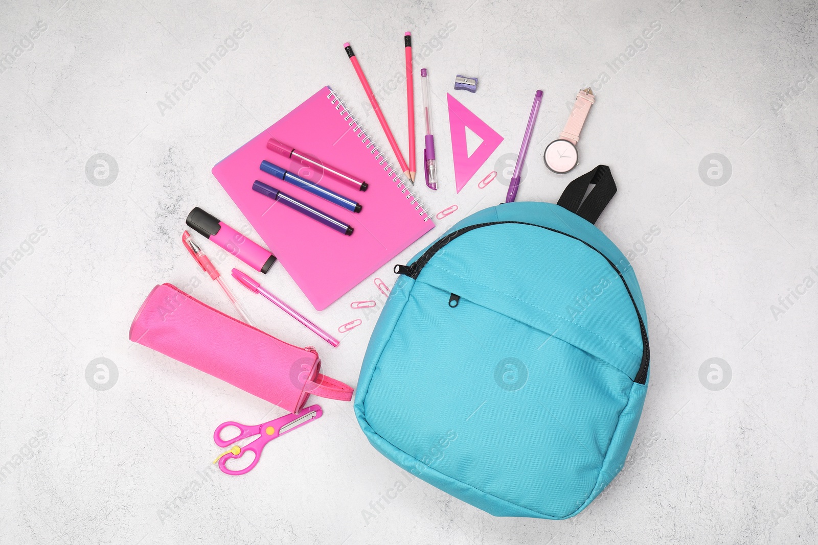 Photo of Flat lay composition with backpack and different school stationery on light grey table