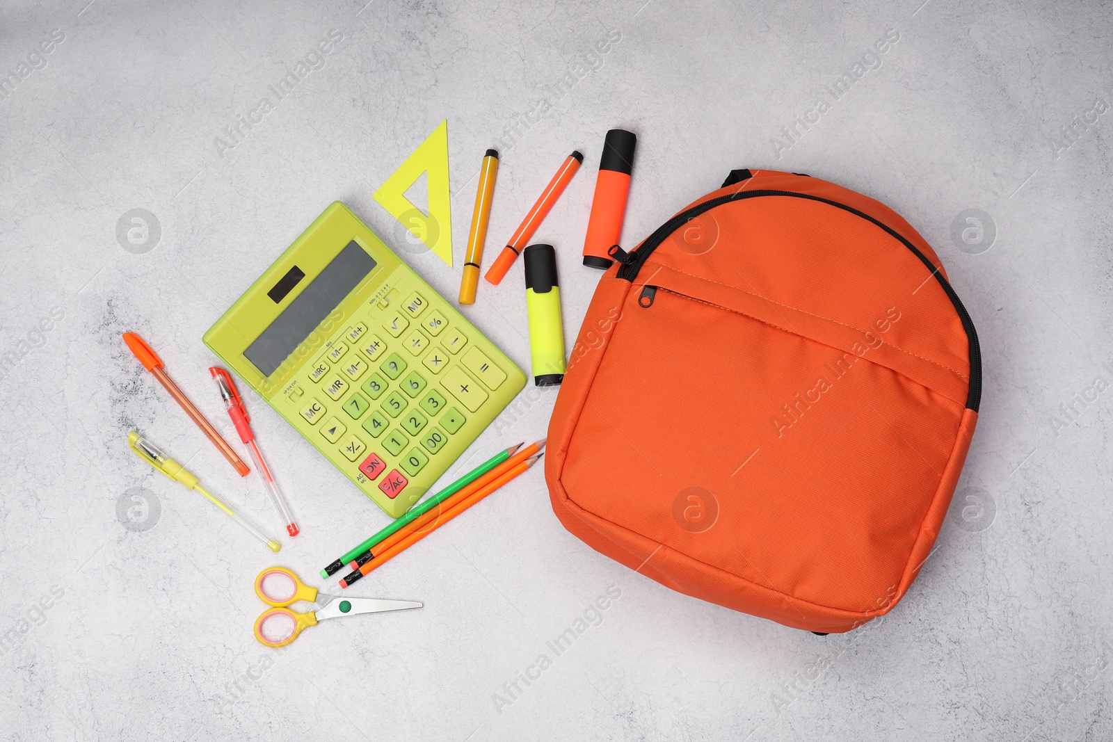 Photo of Flat lay composition with backpack and different school stationery on light grey table