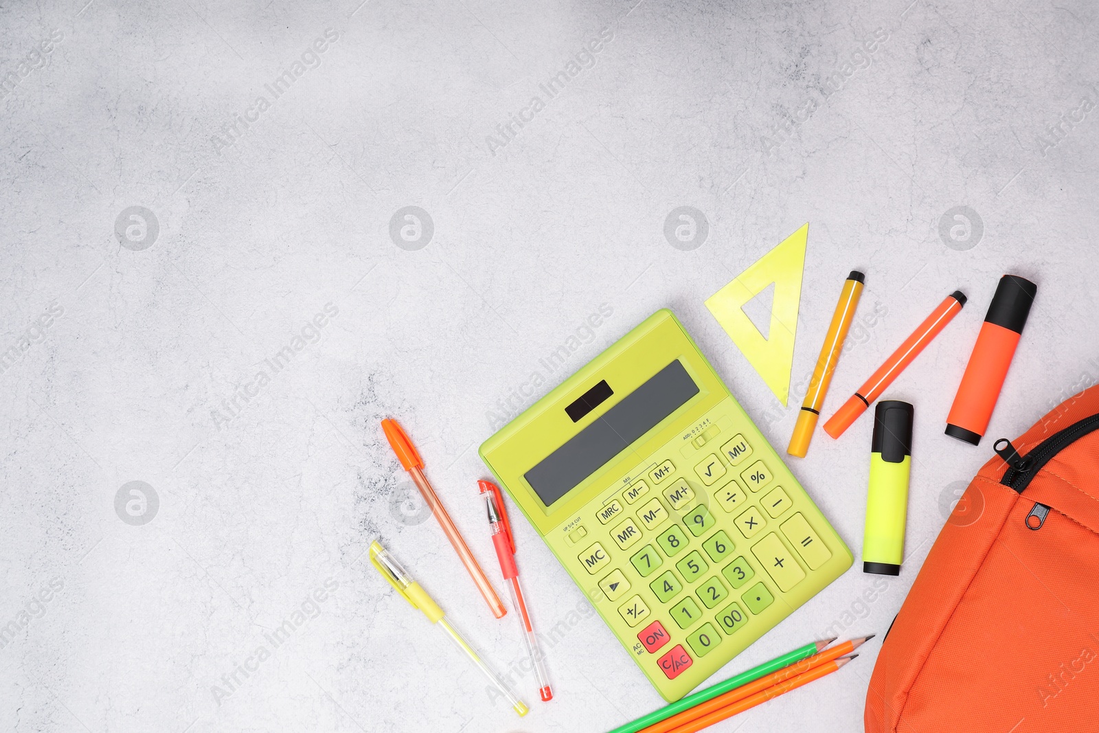 Photo of Flat lay composition with backpack and different school stationery on light grey table, space for text