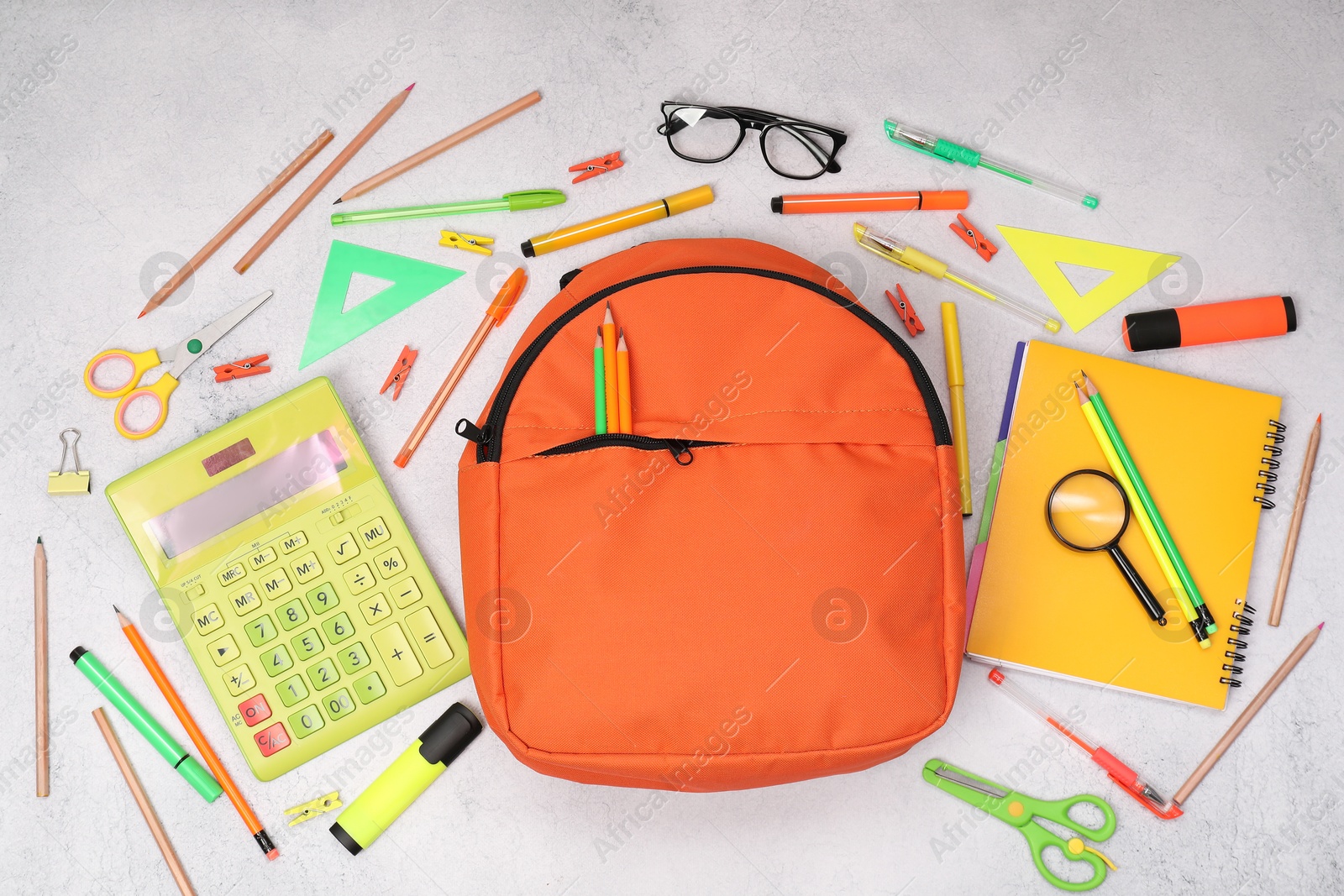 Photo of Flat lay composition with backpack and different school stationery on light grey table