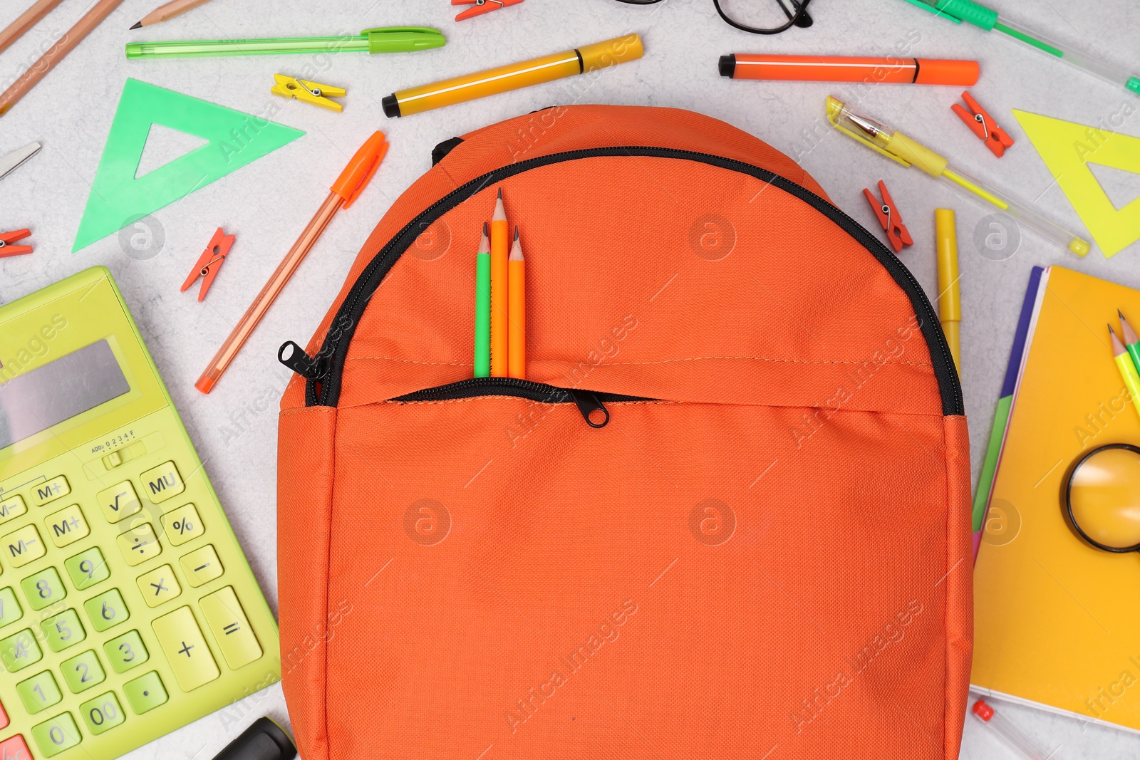 Photo of Flat lay composition with backpack and different school stationery on light grey table