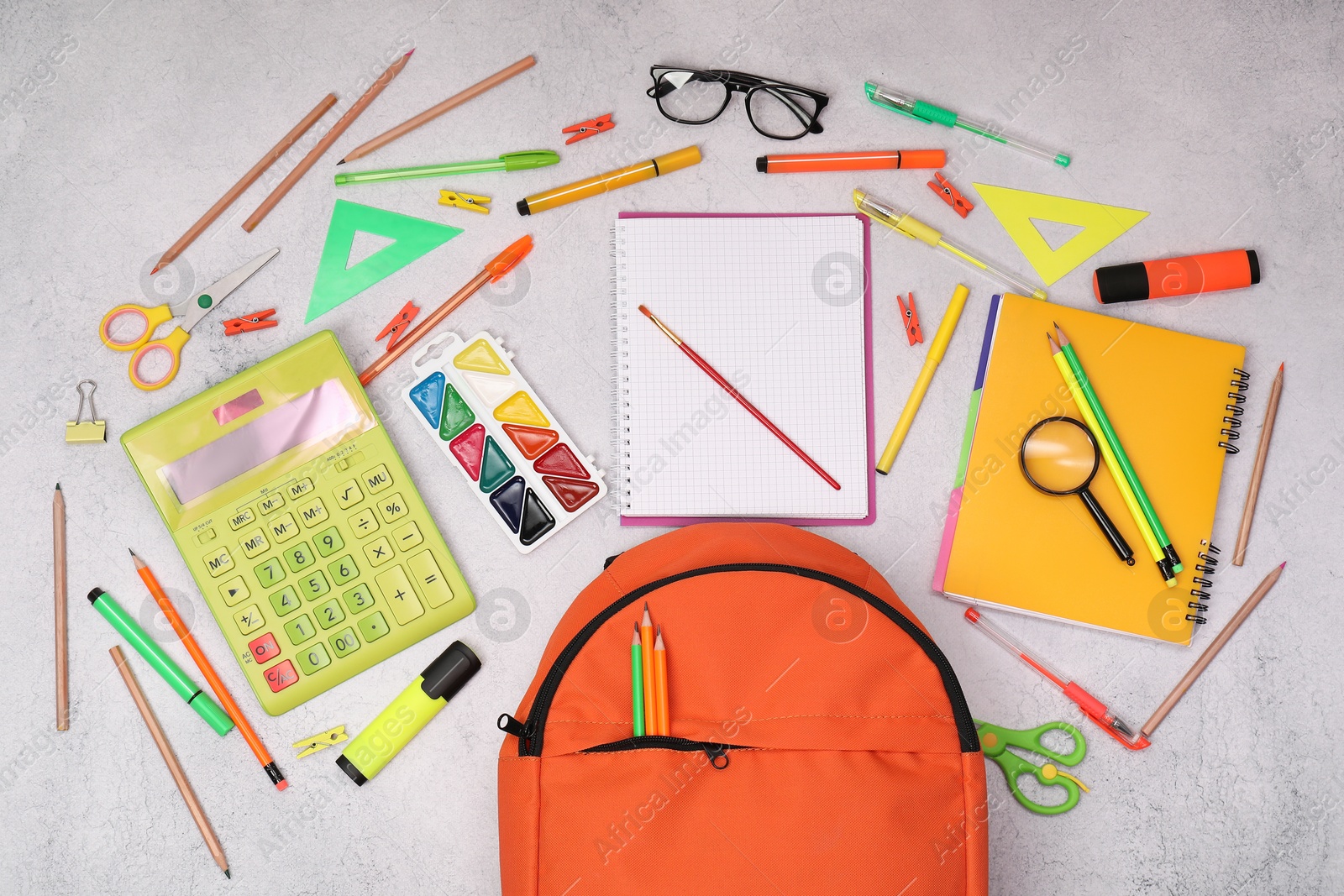 Photo of Flat lay composition with backpack and different school stationery on light grey table