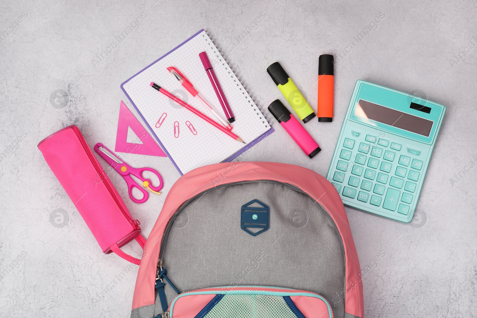 Photo of Flat lay composition with backpack and different school stationery on light grey table