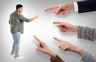 Man and women pointing at each other on grey background. Social pressure, responsibility