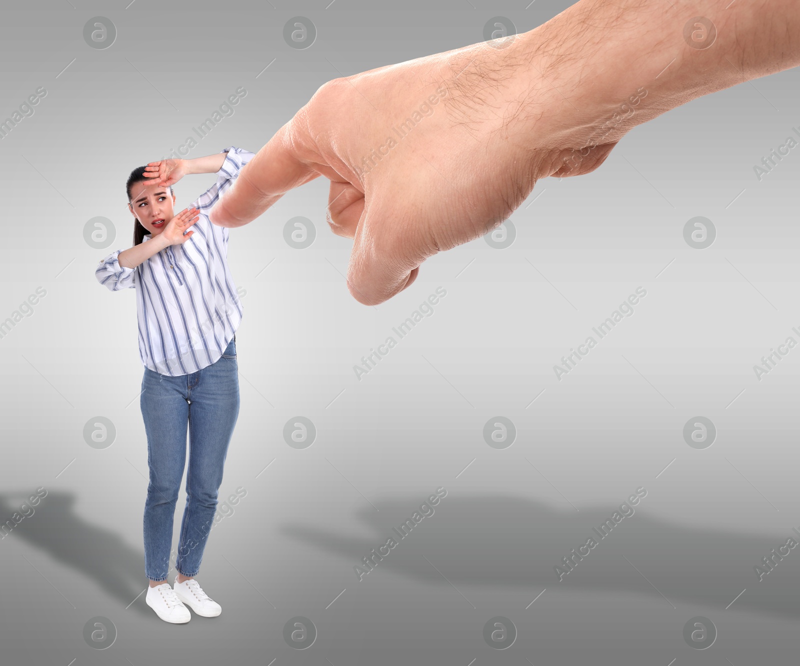 Image of Man pointing at woman on grey background. Social pressure, failure, responsibility