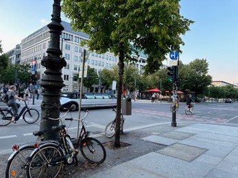 Berlin, Germany - July 30, 2024: Picturesque view of parked bikes on city street