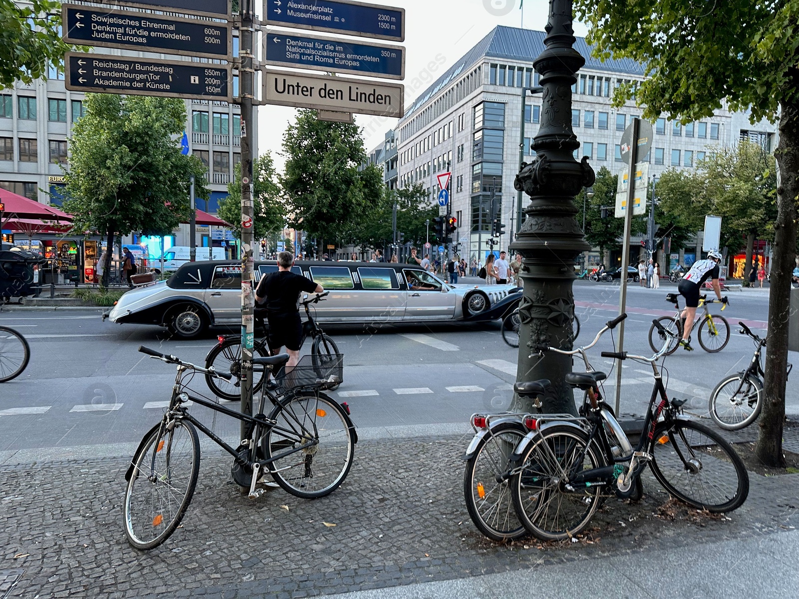 Photo of Berlin, Germany - July 30, 2024: Picturesque view of parked bikes on city street