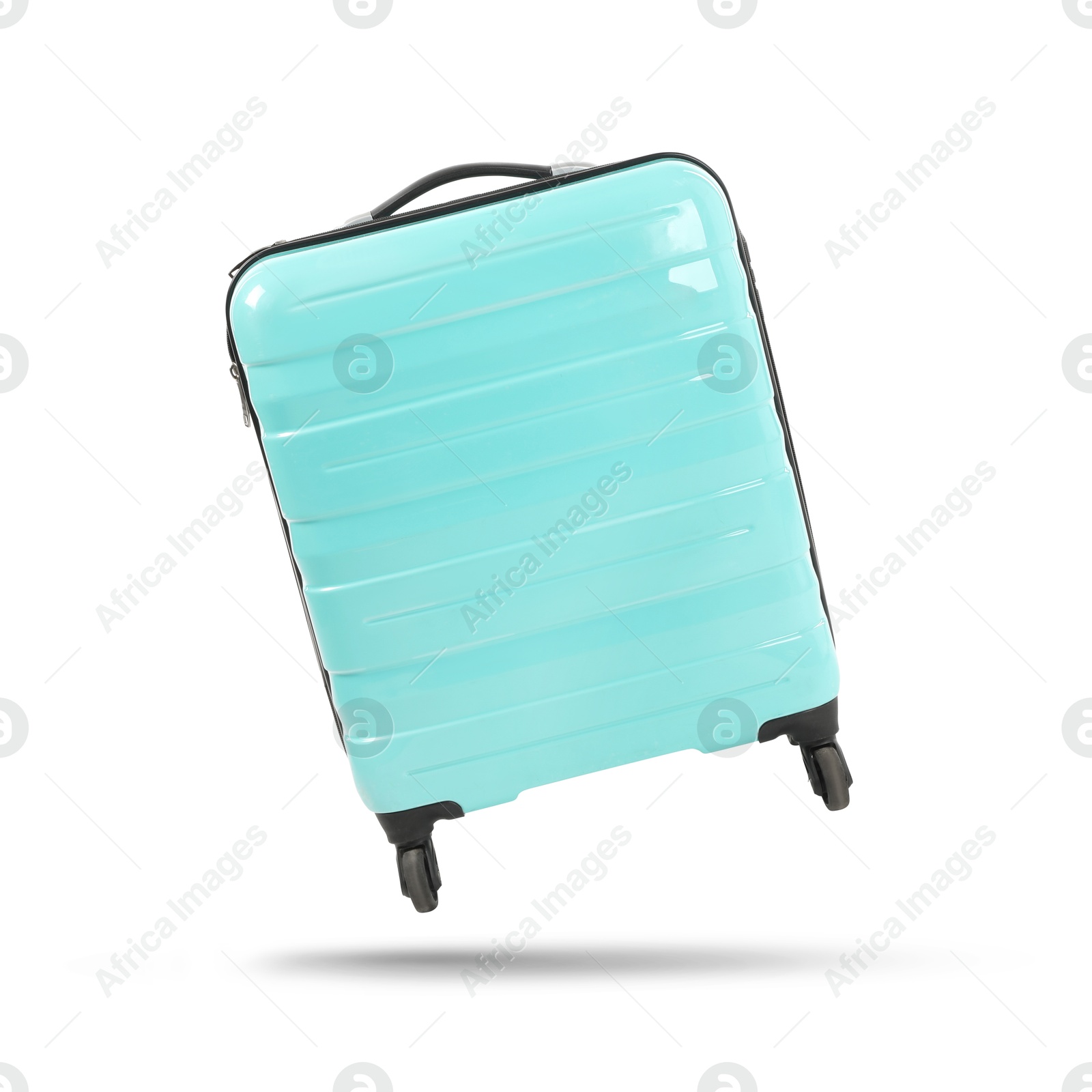 Image of Turquoise suitcase in air on white background