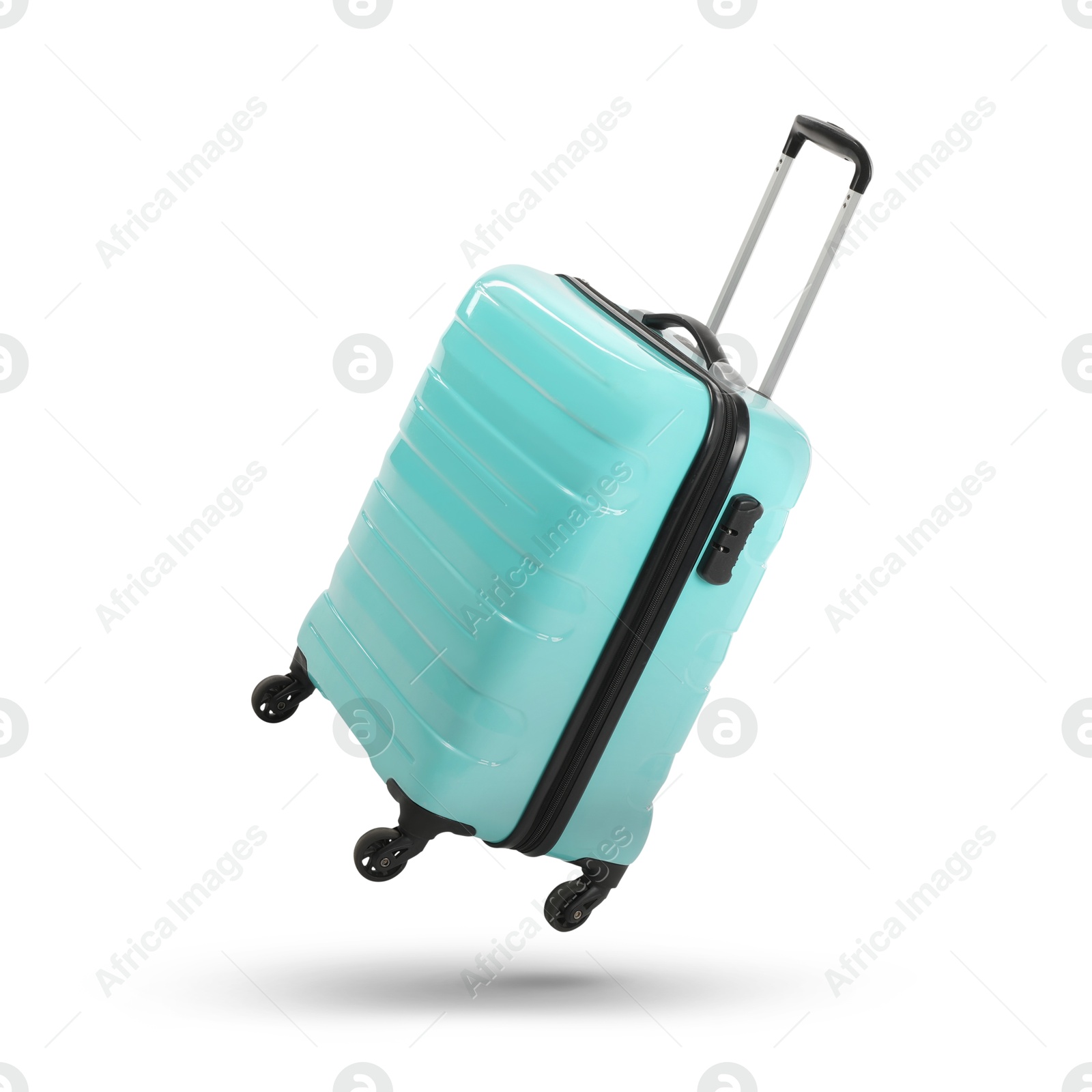 Image of Turquoise suitcase in air on white background