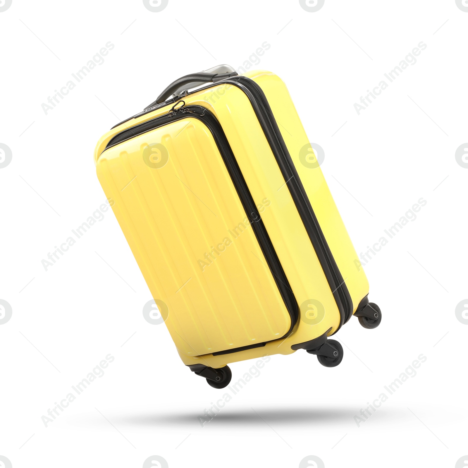 Image of Yellow suitcase in air on white background