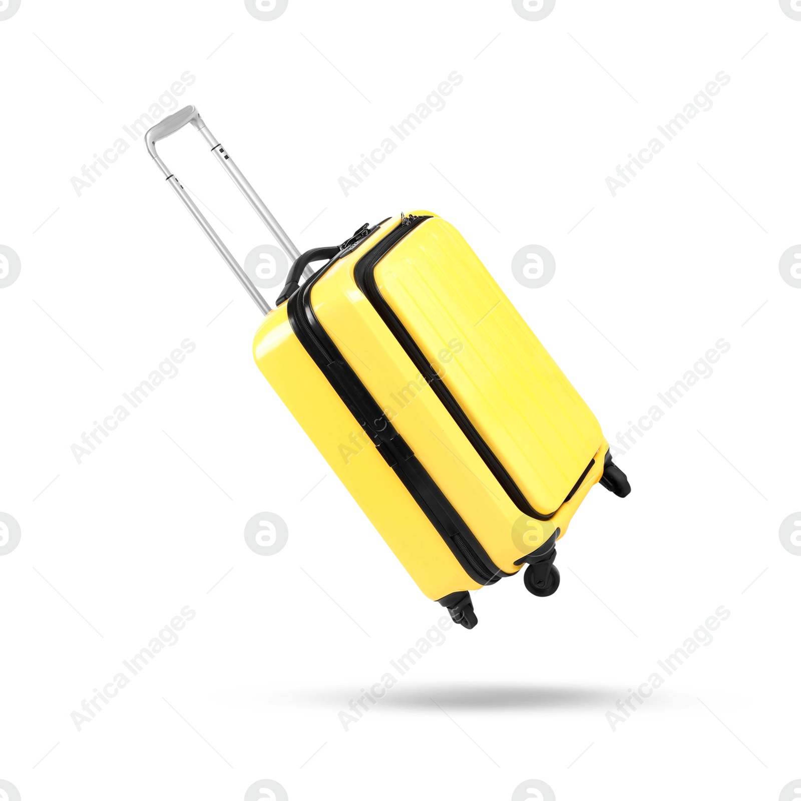 Image of Yellow suitcase in air on white background