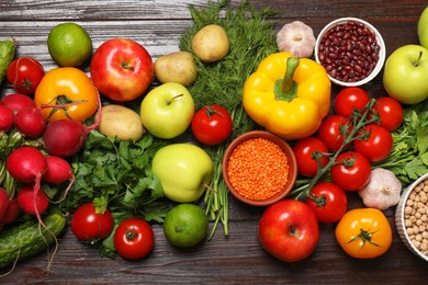 Different vegetarian products on wooden table, top view