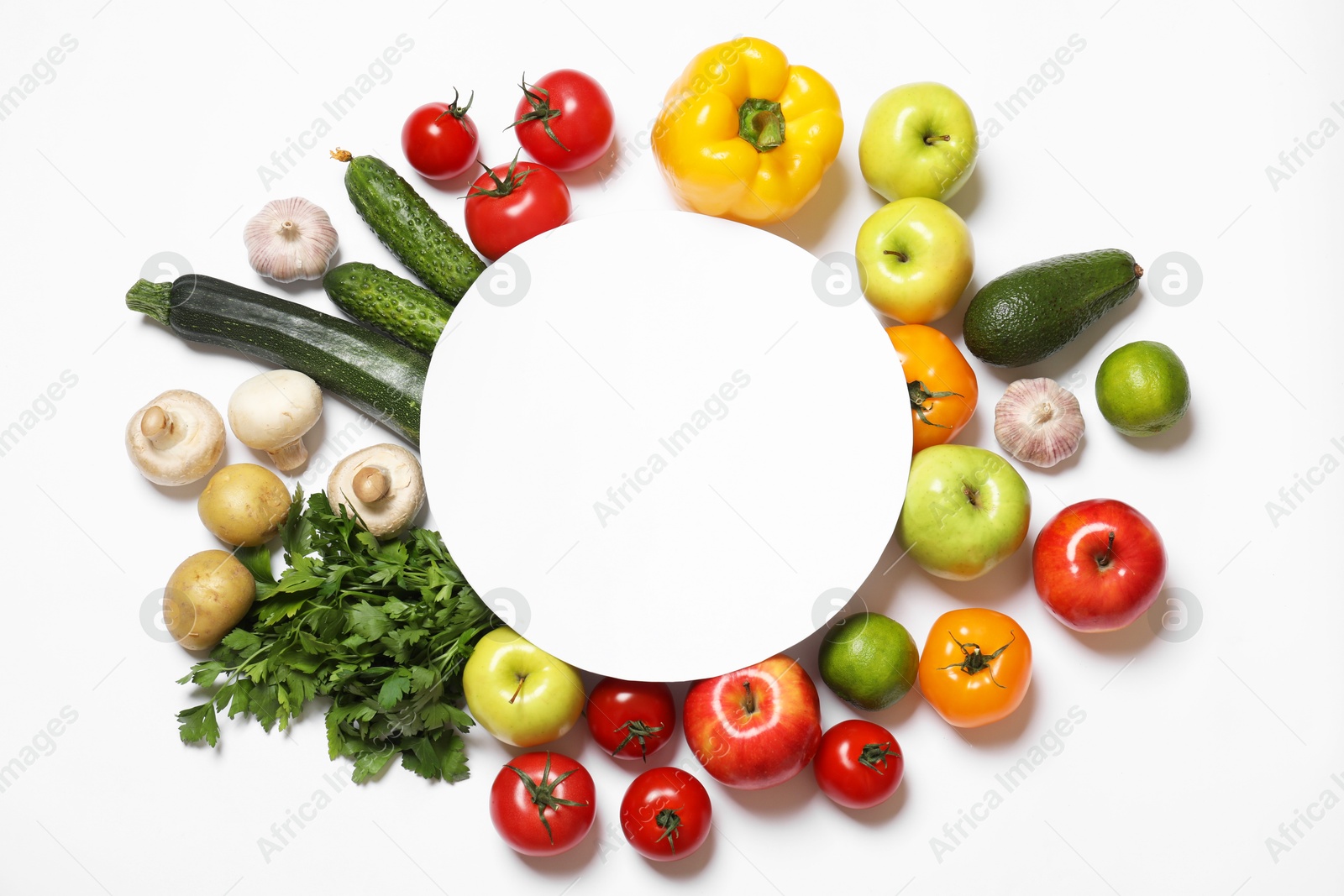 Photo of Healthy vegetarian food. Paper card surrounded by different vegetables, mushrooms and fruits on white background, flat lay