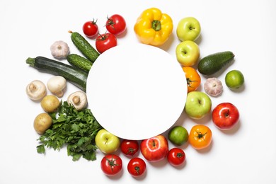 Photo of Healthy vegetarian food. Paper card surrounded by different vegetables, mushrooms and fruits on white background, flat lay