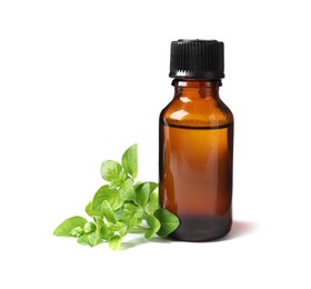 Photo of Essential oil in bottle and oregano leaves isolated on white