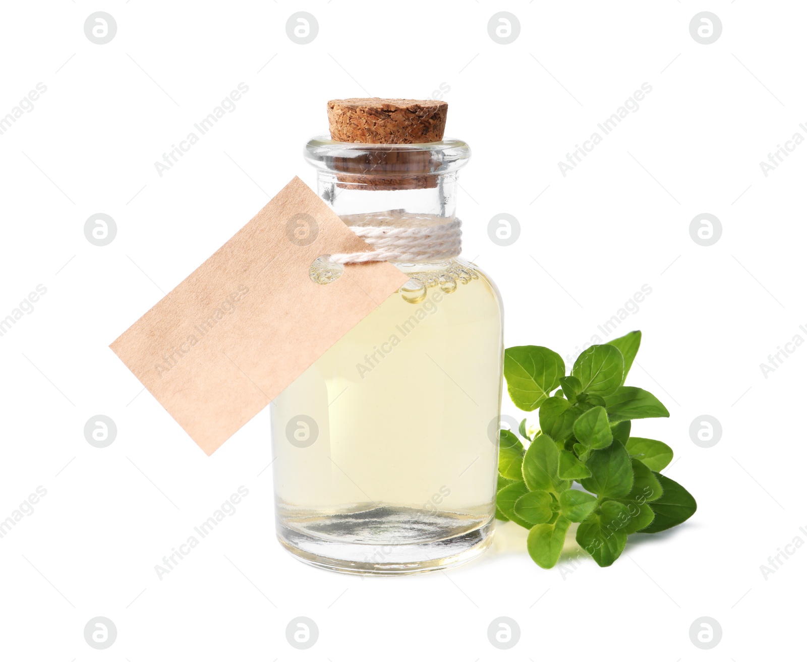 Photo of Essential oil in bottle with empty tag and oregano leaves isolated on white