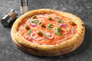 Photo of Delicious vegetarian pizza on black table, closeup