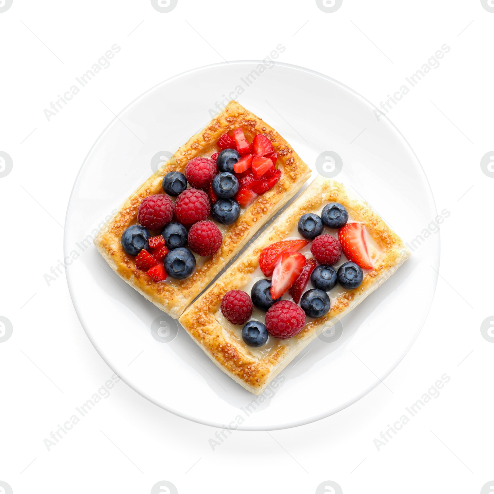 Photo of Tasty puff pastries with berries isolated on white, top view