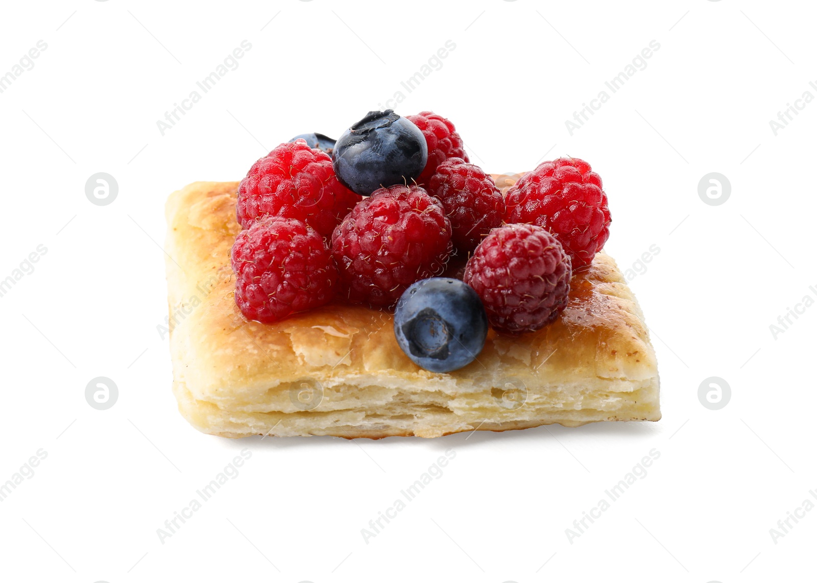 Photo of Tasty puff pastry with berries isolated on white