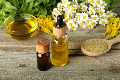 Photo of Tinctures and medicinal herbs on wooden table