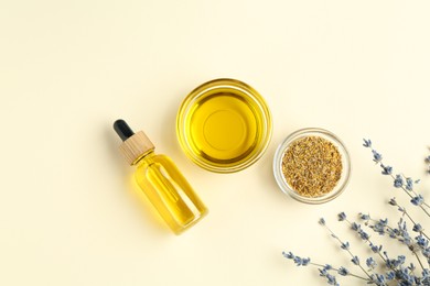 Photo of Tinctures and medicinal herbs on beige background, flat lay