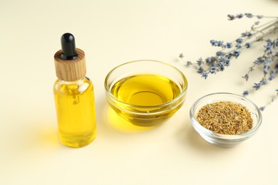 Photo of Tinctures and medicinal herbs on beige background