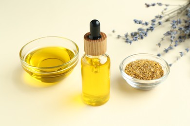 Photo of Tinctures and medicinal herbs on beige background