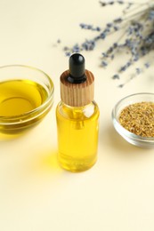 Photo of Tinctures and medicinal herbs on beige background