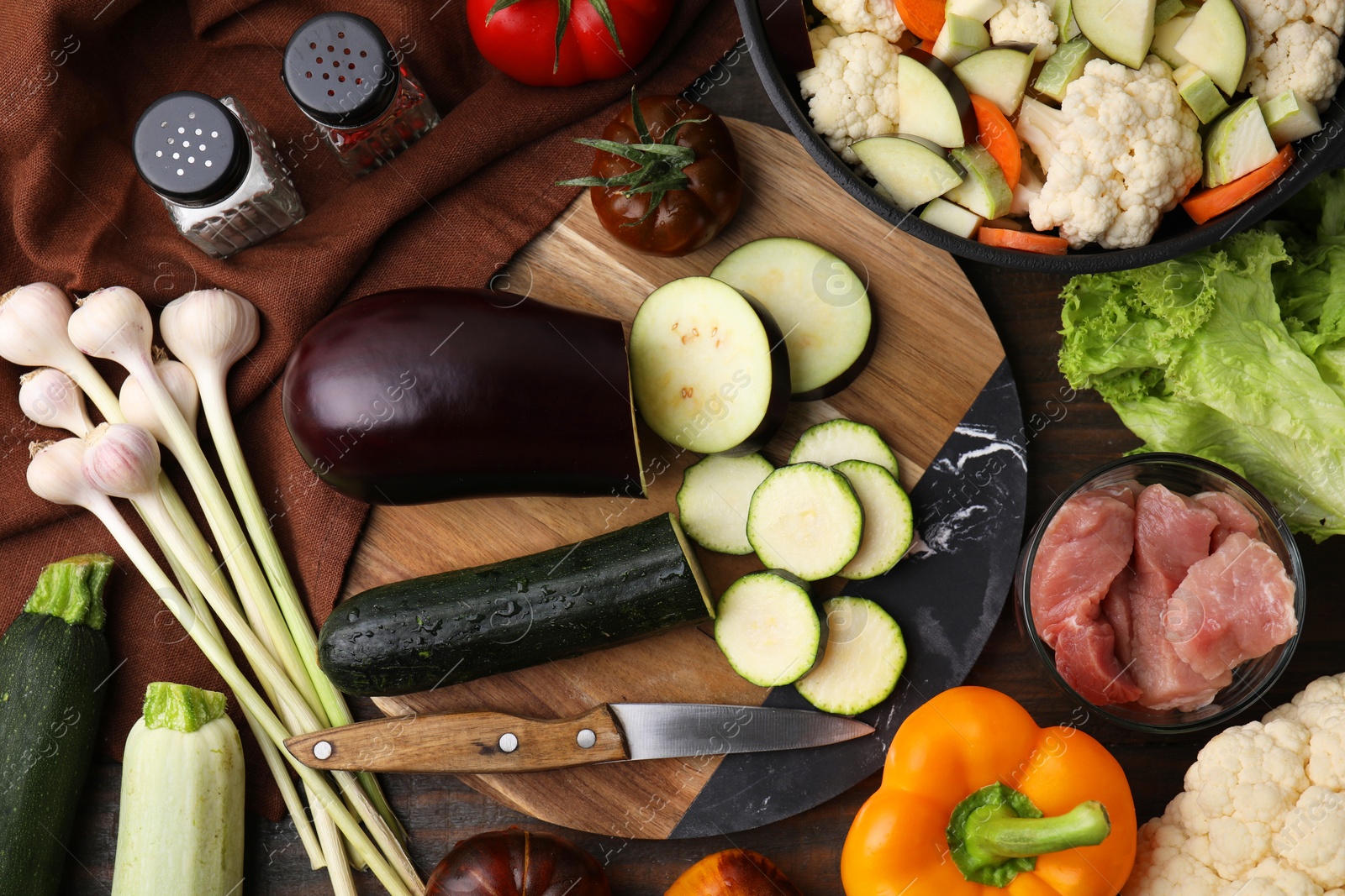 Photo of Different ingredients for stew on wooden table, flat lay