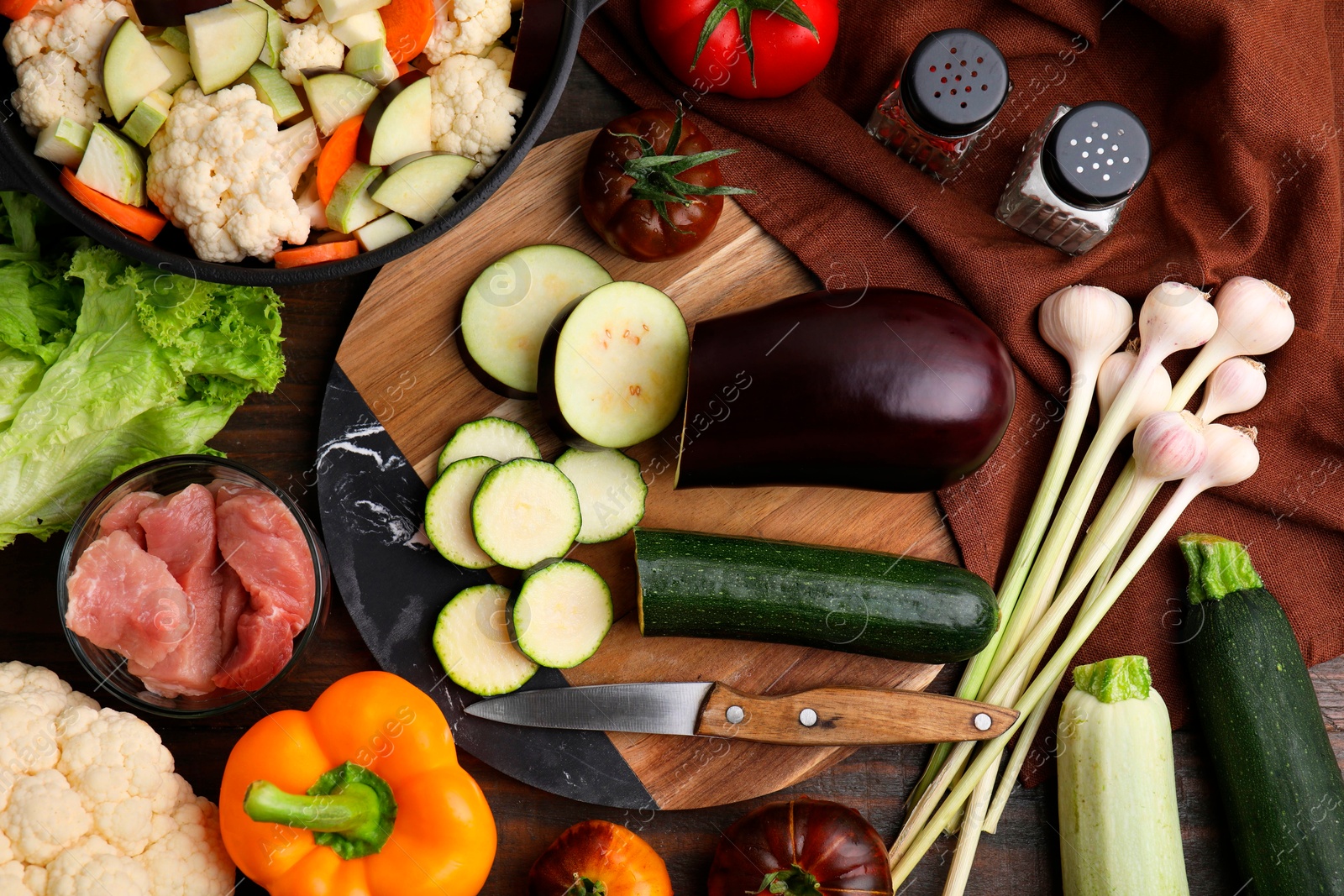 Photo of Different ingredients for stew on wooden table, flat lay