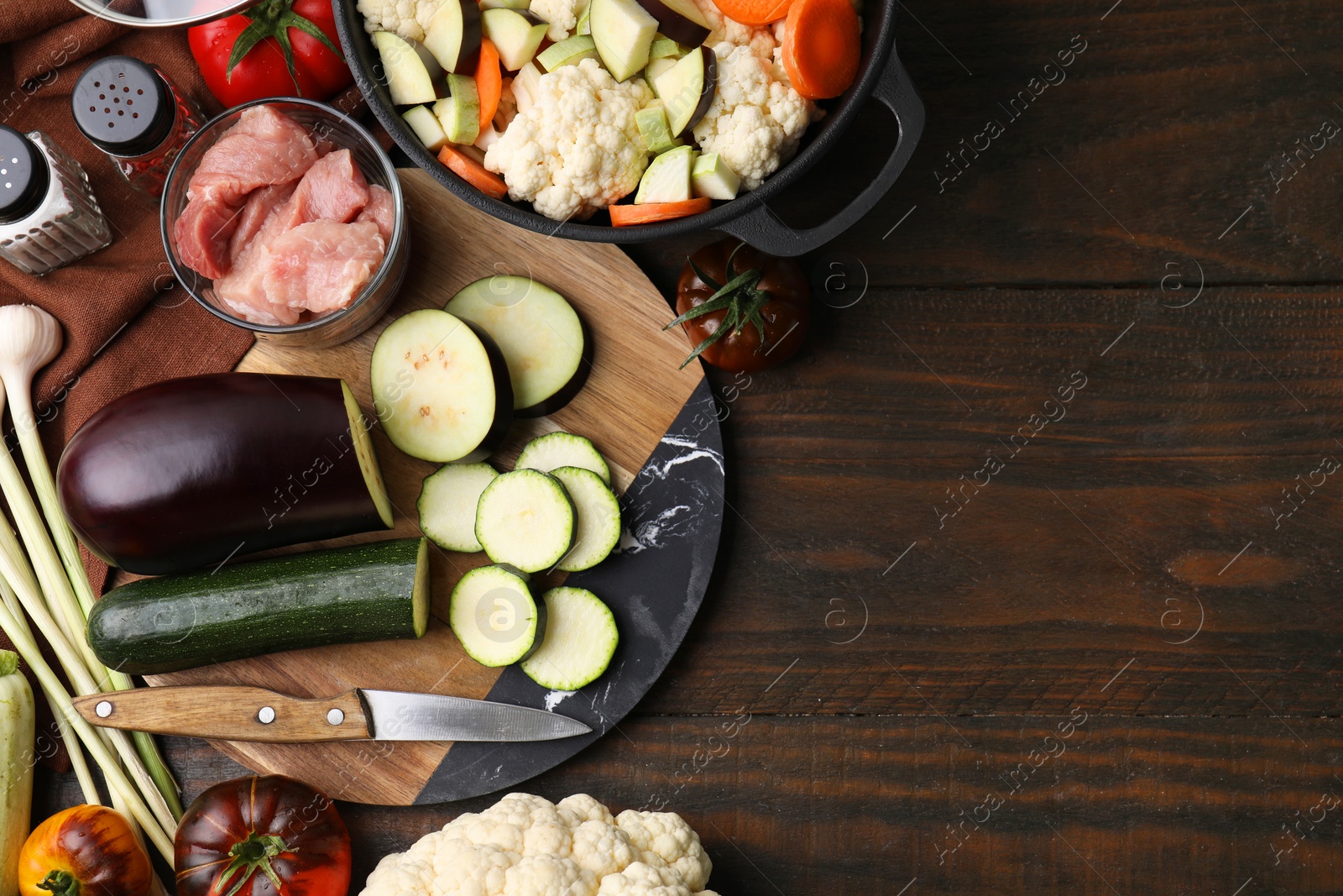 Photo of Different ingredients for stew on wooden table, flat lay