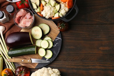 Photo of Different ingredients for stew on wooden table, flat lay