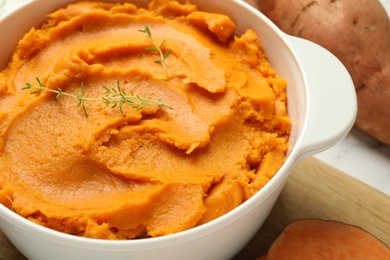 Delicious mashed sweet potatoes in pot on table, closeup