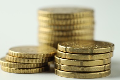 Stacked euro coins on white background, closeup