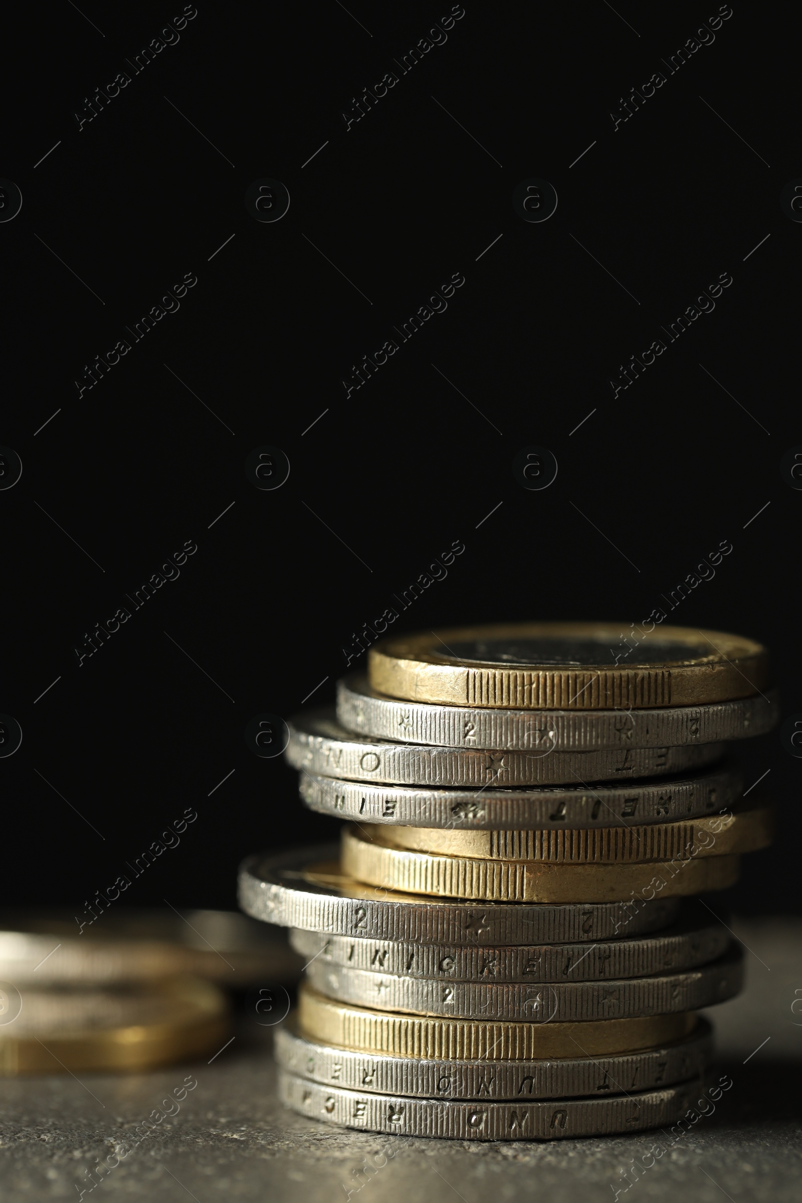 Photo of Stack of euro coins on grey table