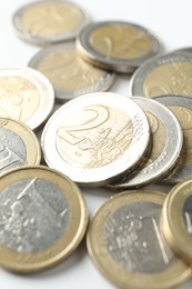 Many euro coins on white background, closeup