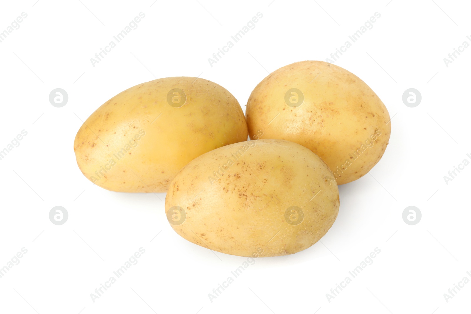 Photo of Three young fresh potatoes isolated on white