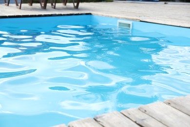 Photo of View of outdoor swimming pool with clear water