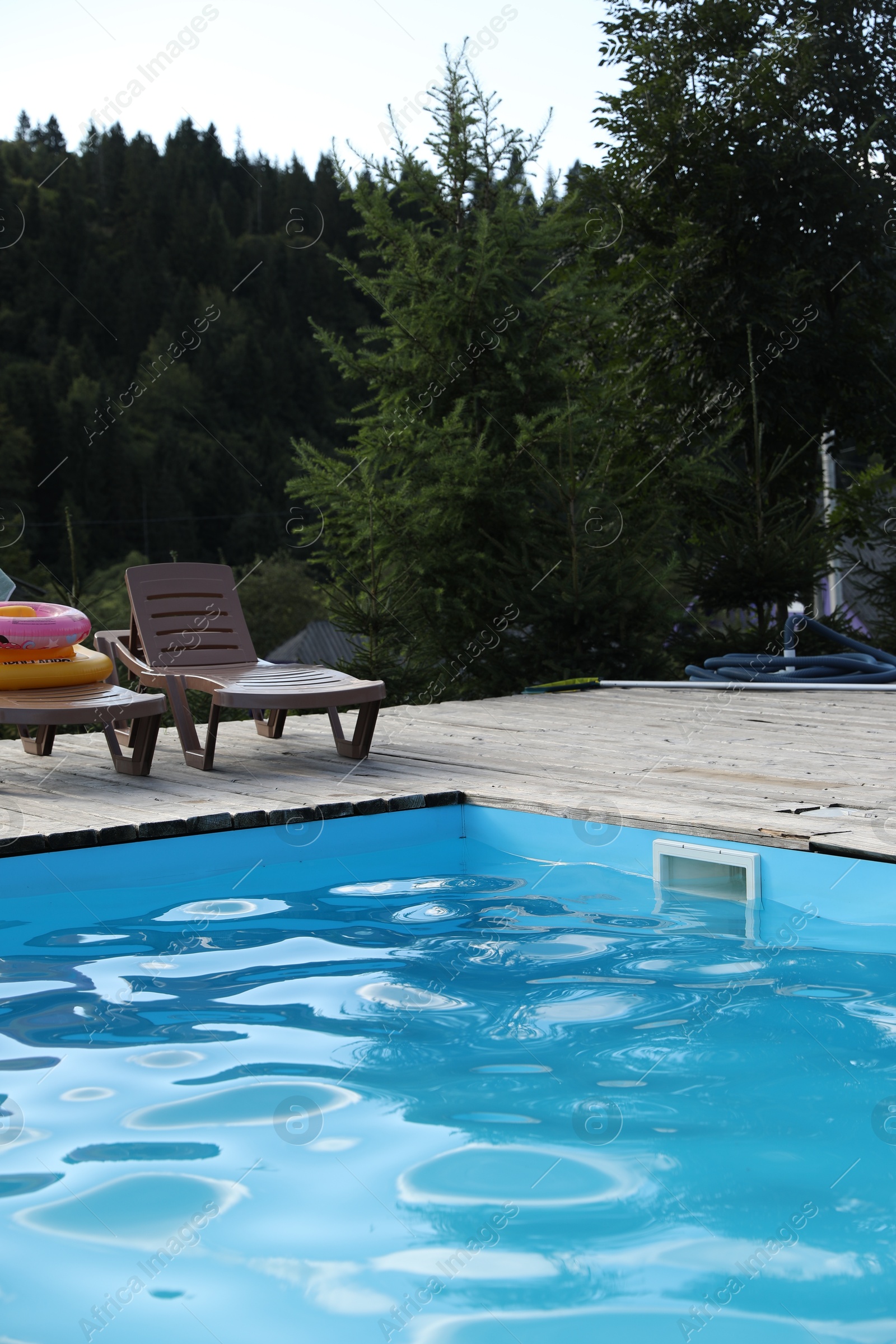 Photo of Outdoor swimming pool and sunbeds in luxury hotel