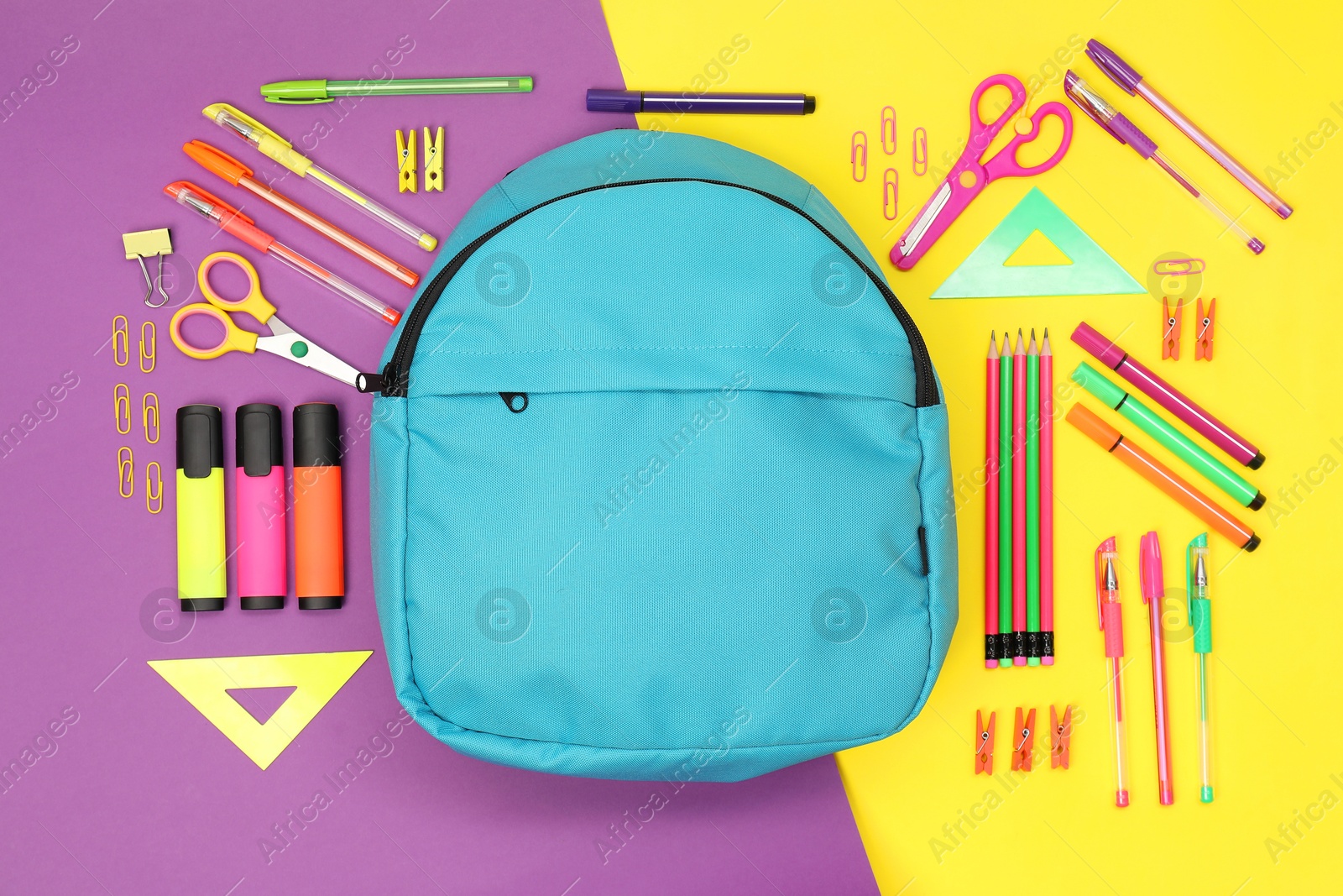 Photo of Flat lay composition with backpack and different school stationery on color background