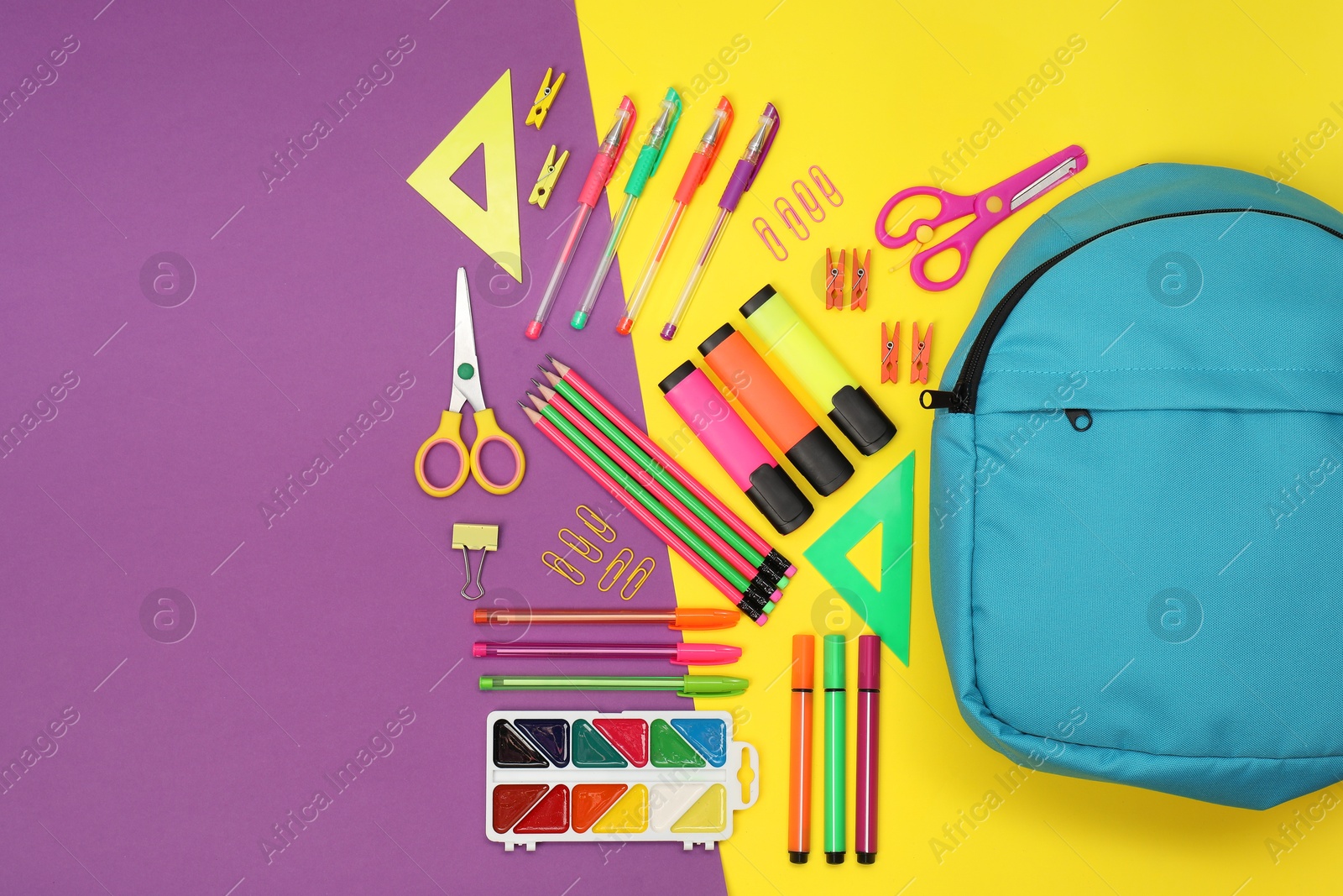 Photo of Flat lay composition with backpack and different school stationery on color background, space for text